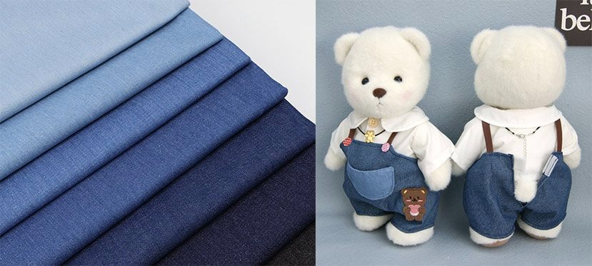 Multiple shades of blue denim fabric on the left and two white teddy bears dressed in denim overalls on the right.