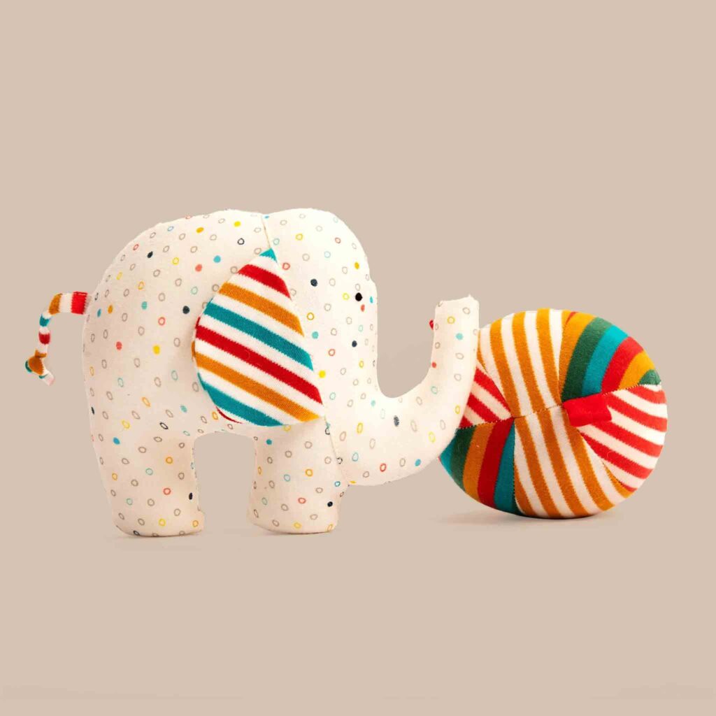 Colorful striped elephant plush toy with ball