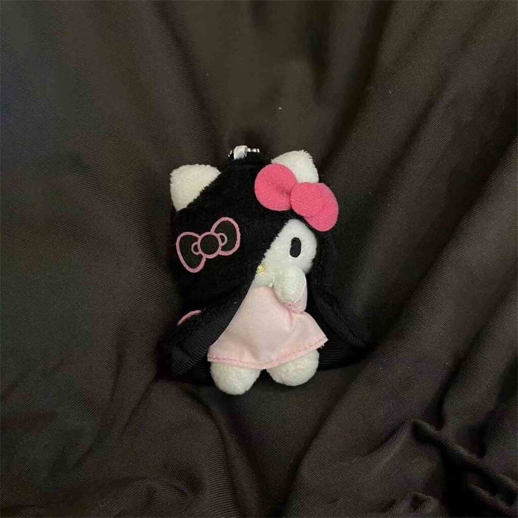Small white plush with pink bow keychain