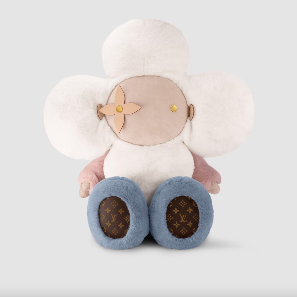 Luxury plush doll with monogrammed feet and flower eye