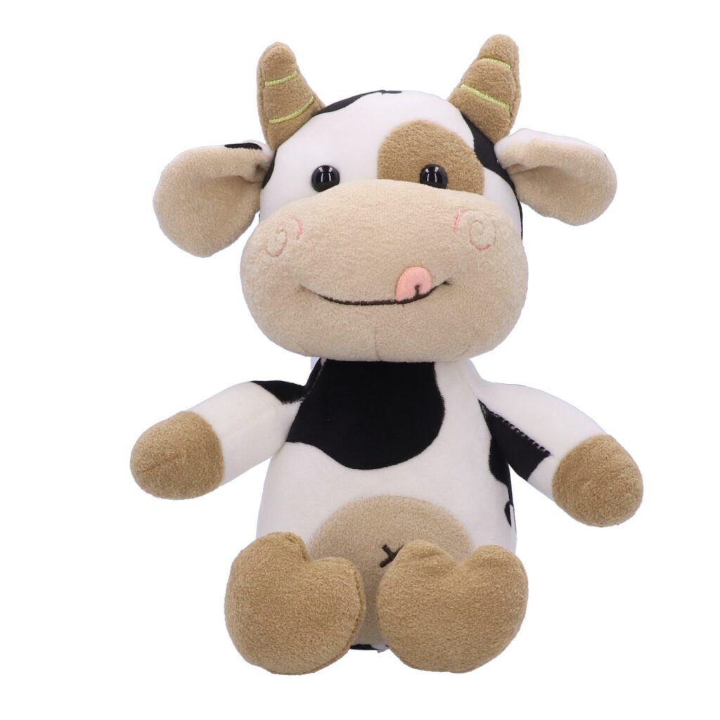 Schattig zwart-wit koe knuffeldier met bruine horens en lachend gezicht.