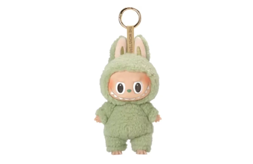 Cute green fuzzy plush keyring with bunny ears and smiling face.
