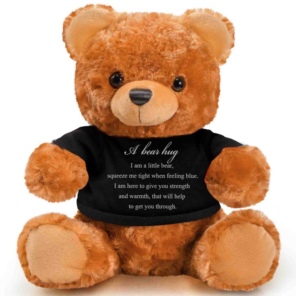 Brown teddy bear wearing black shirt with heartfelt “A bear hug” support message.