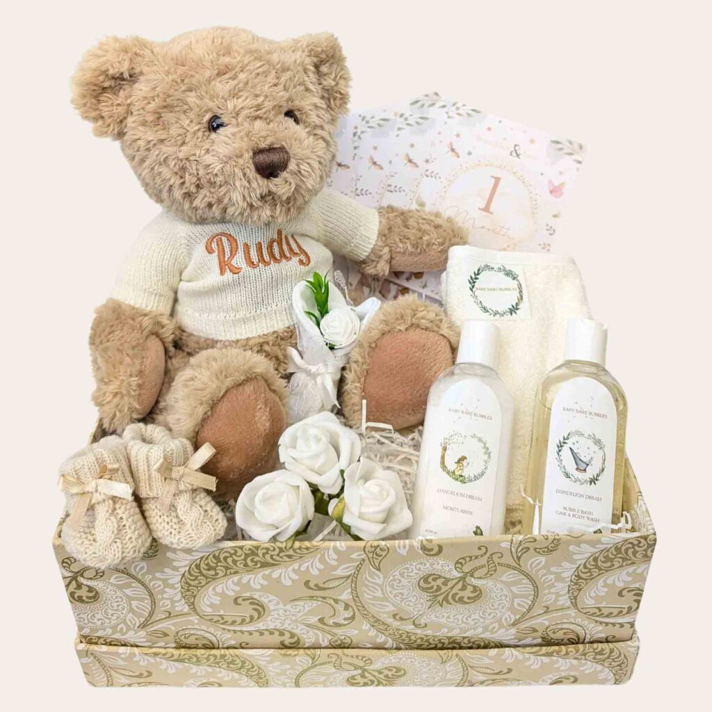 Teddy bear baby hamper with skincare and flowers
