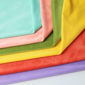 Soft colorful fabric sheets stacked neatly