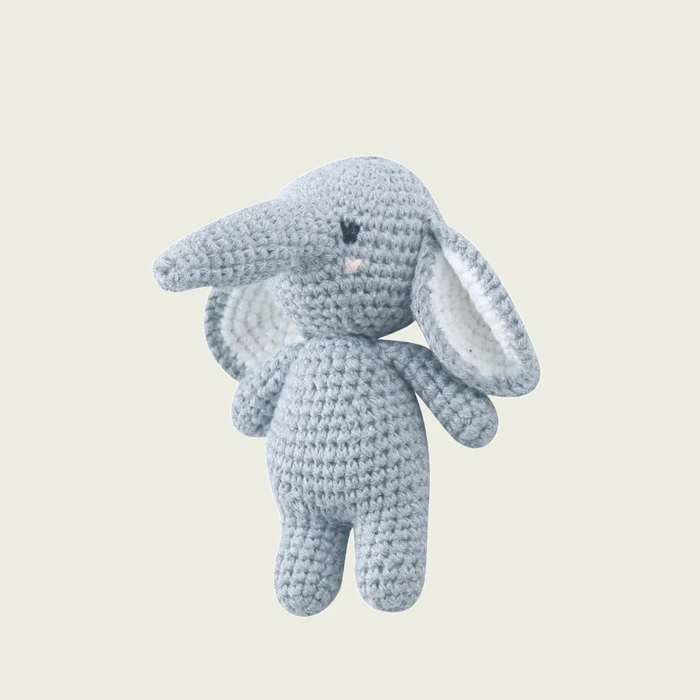 Small gray crocheted elephant with white ears