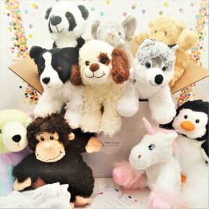 Assorted animal plush toys including dog, unicorn, and penguin