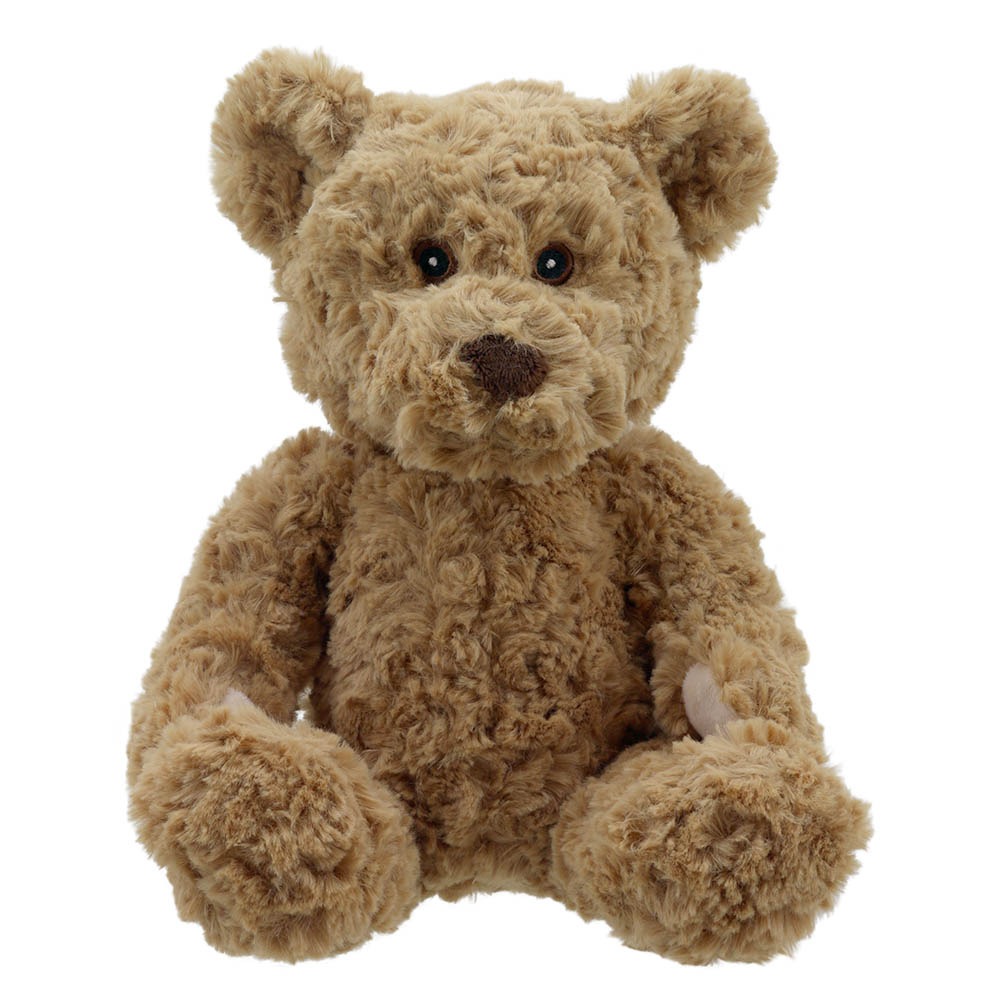 Ours en peluche marron avec une fourrure douce et des yeux en forme de boutons.