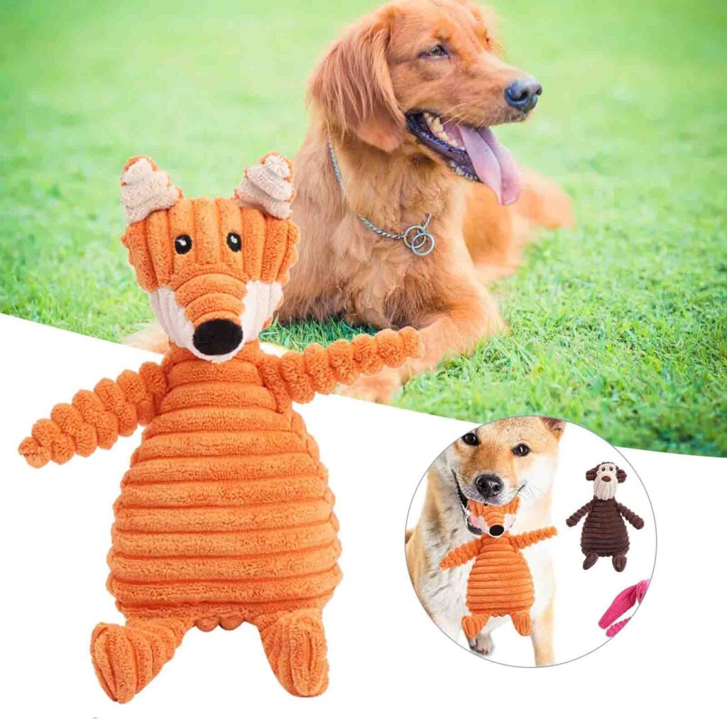 Jouet pour chien renard en velours côtelé orange avec chiens sur fond d'herbe