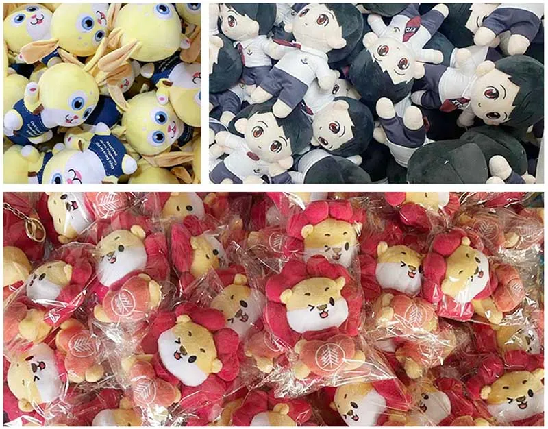 Pile of various plush toys including yellow animals, anime dolls, and packaged lion characters.