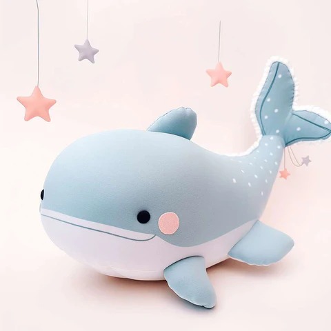 Large blue whale plush with star decorations