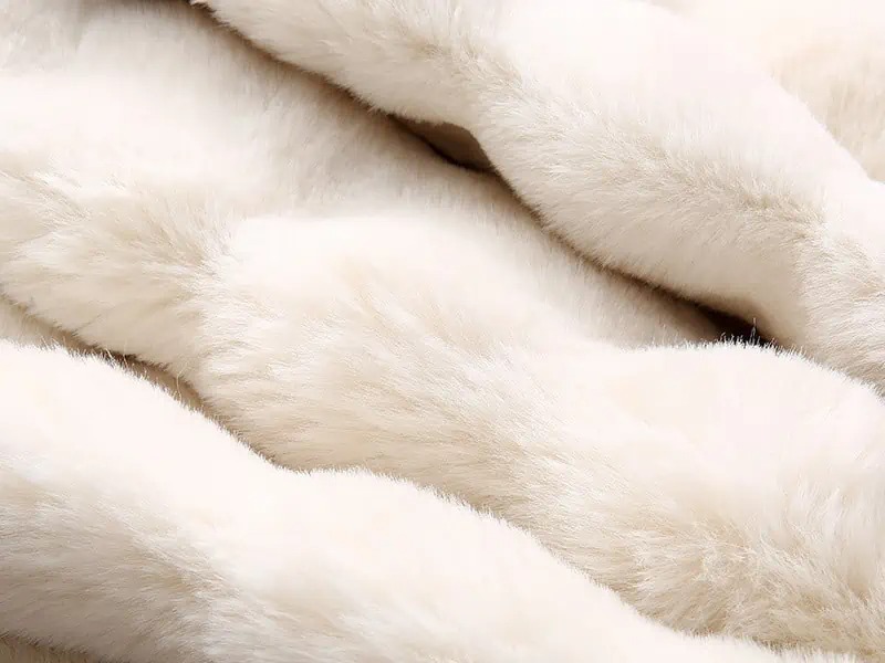 Soft white plush fabric texture.