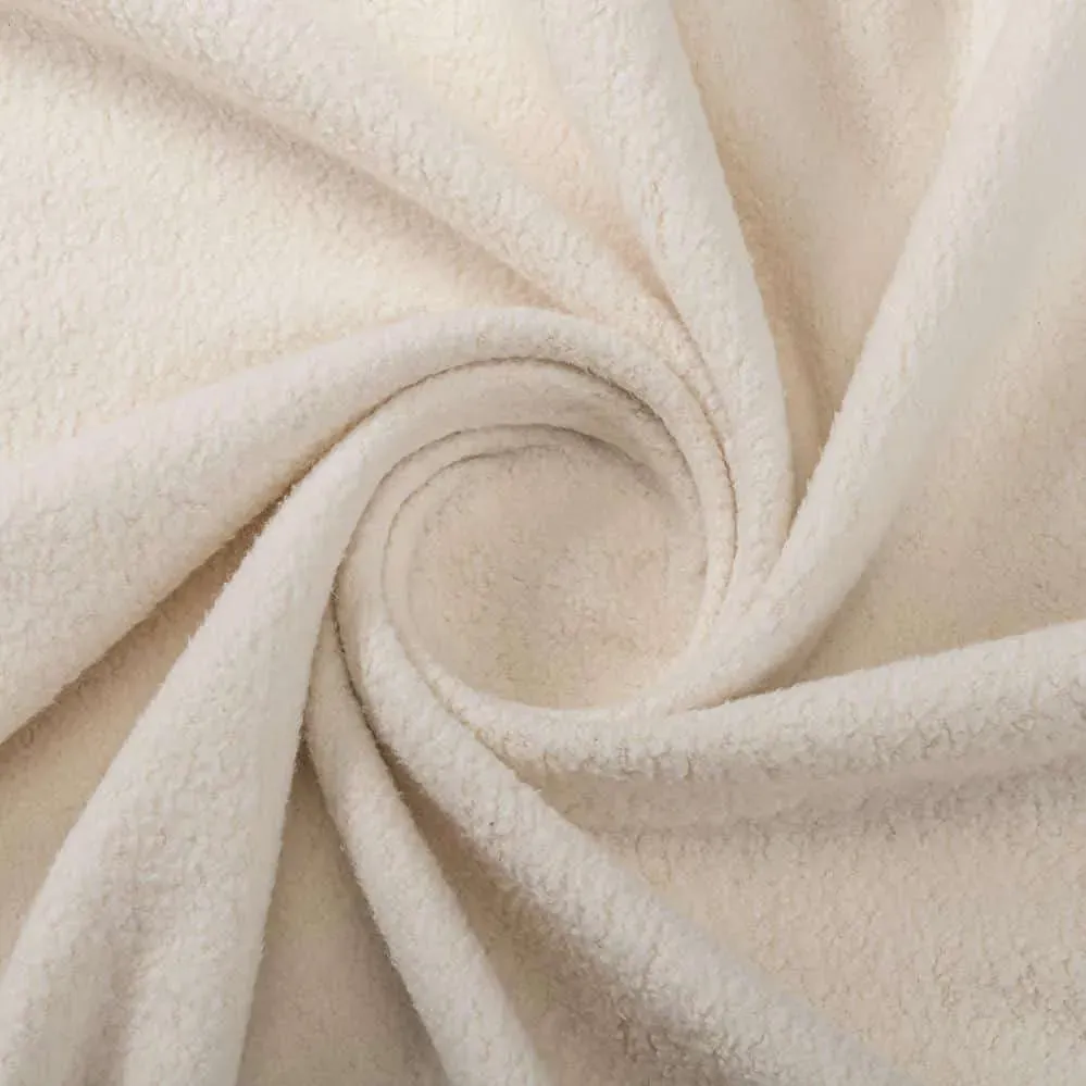Swirled cream-colored cotton sherpa fabric with soft, textured surface
