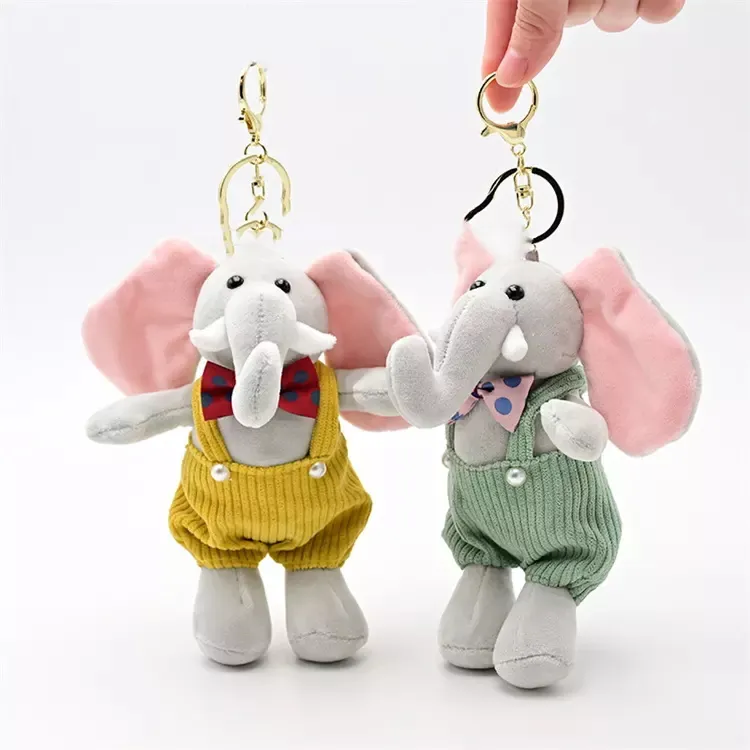 Two elephant plush keychains with bow ties and suspenders.