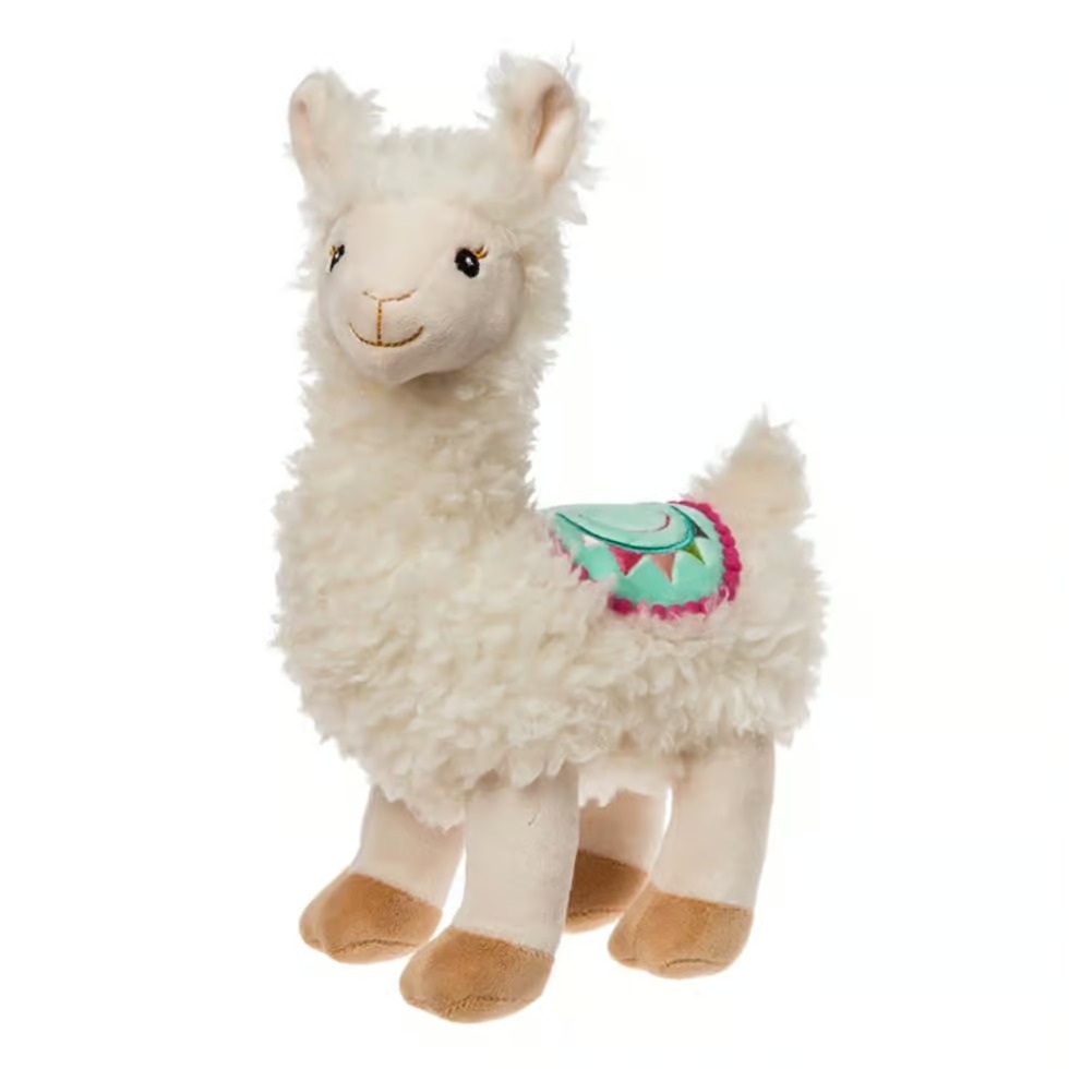 Cream-colored llama plush toy featuring a soft textured body, embroidered face, and a decorative turquoise and pink saddle.