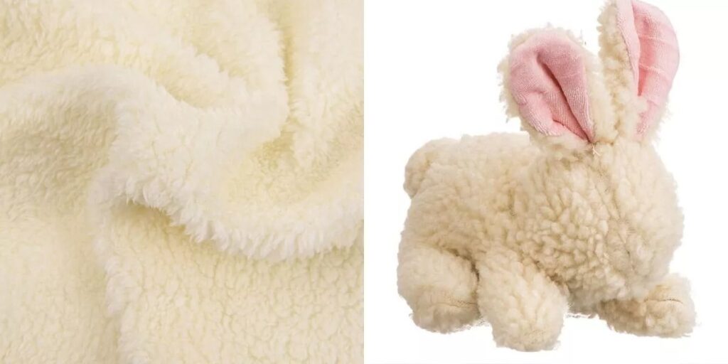 Cream sherpa fabric and plush bunny toy with pink ears.