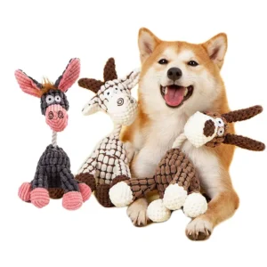 Smiling dog lying with three textured animal plush toys on white background