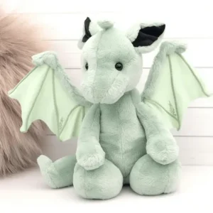 Soft light green dragon plush with wings and black ears.