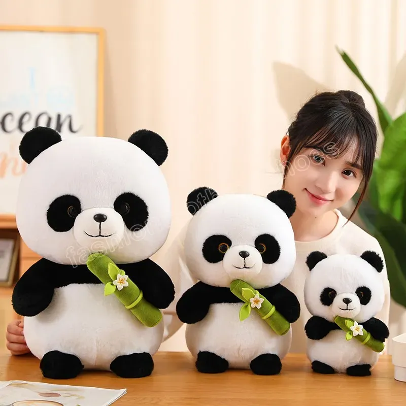 Woman with three plush panda toys in different sizes.