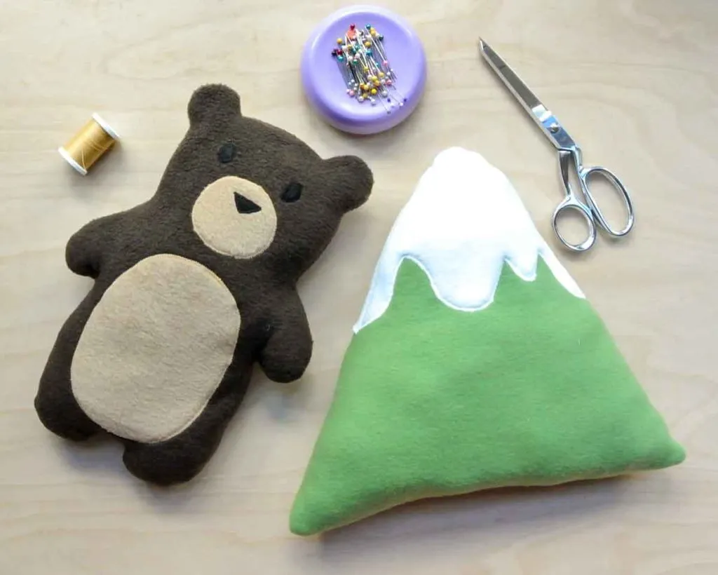 Handmade bear and mountain plush toys