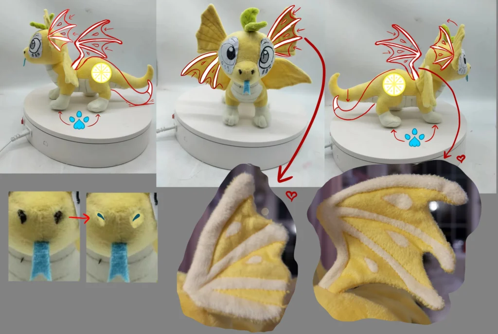 Yellow plush dragon prototype with red sketches showing design changes on wings, eyes, and tail details.