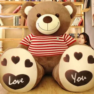 Giant teddy bear with love hearts on paws and striped sweater