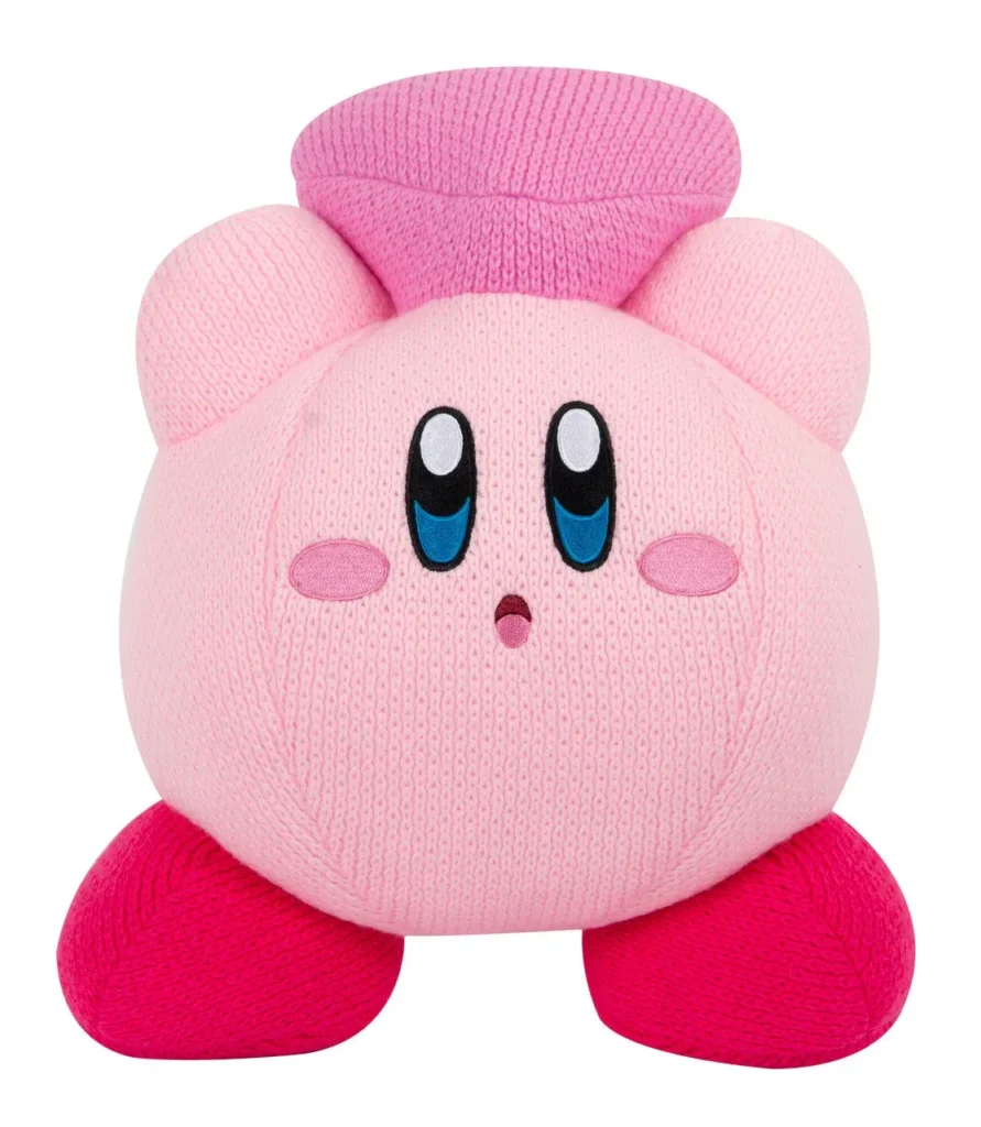 Pink knit Kirby plush toy with big eyes and red feet