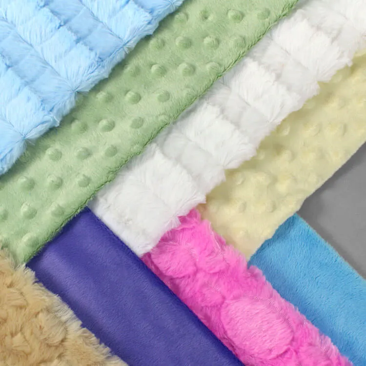 Soft colorful minky fabric rolls with textured patterns and plush feel.