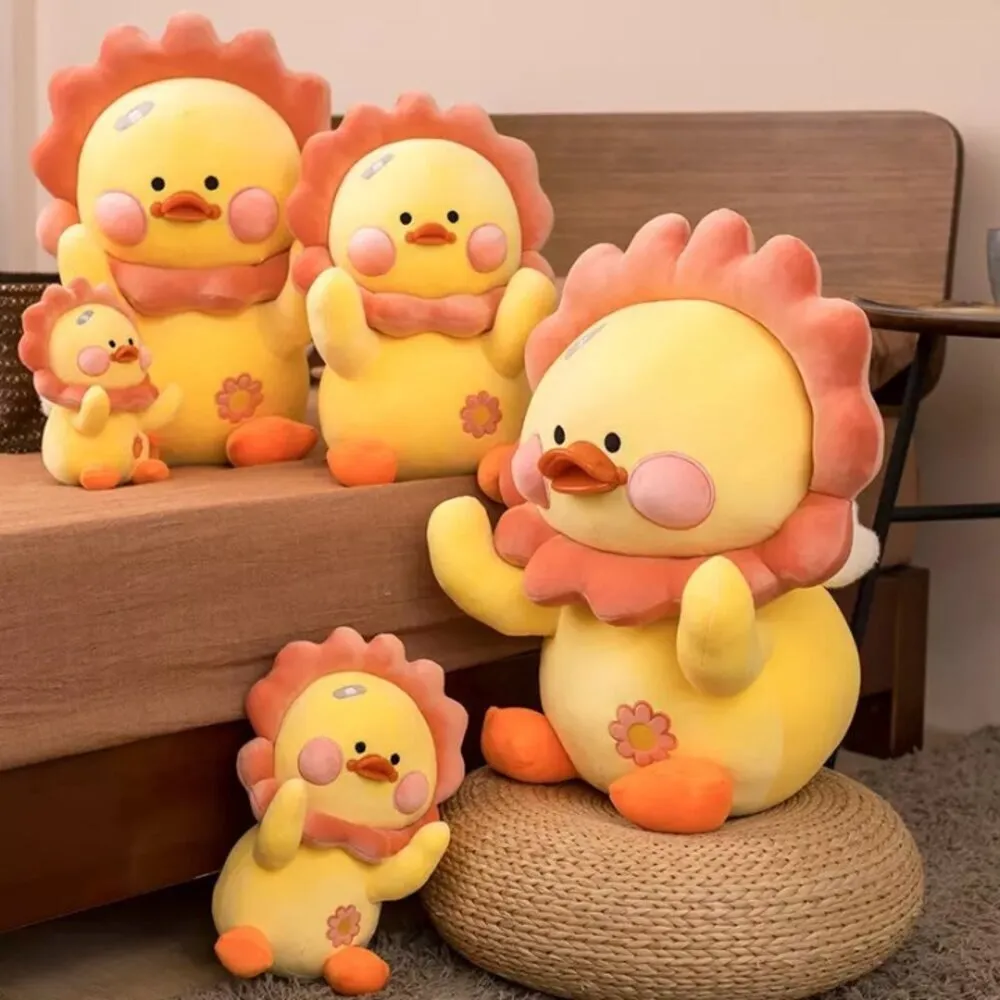 Set of yellow plush chick toys with orange beaks and pink cheeks arranged in a cozy room