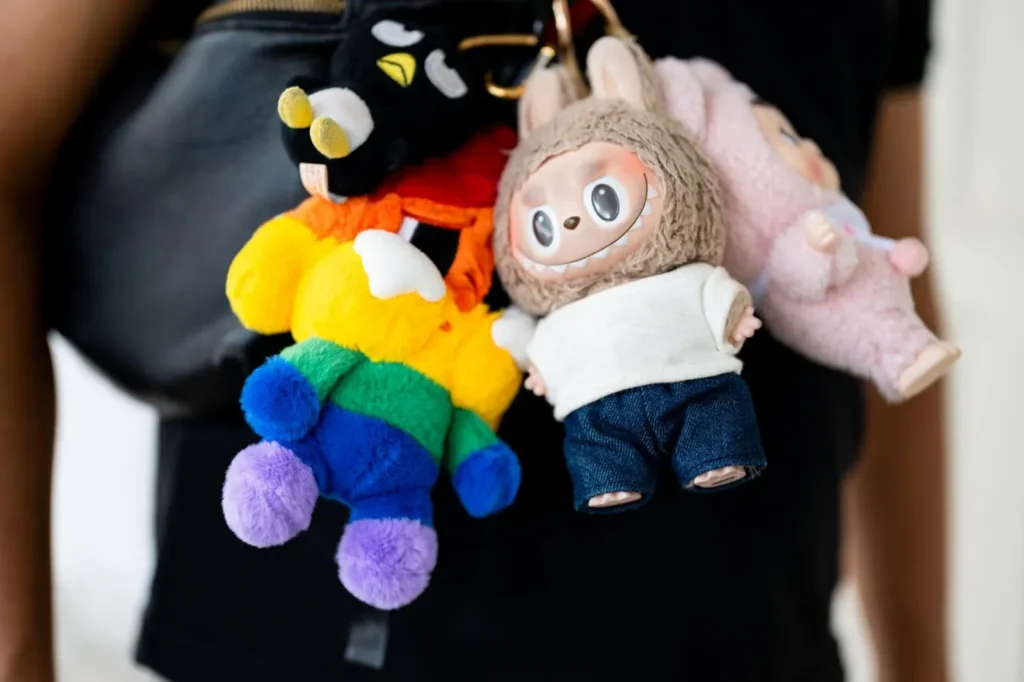 Colorful and cute plush toy keychains hanging on a bag or person