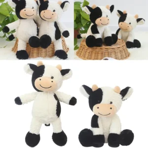 Cute black and white cow plush toys with smiling faces.