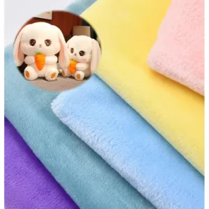 Soft velboa plush fabric in purple, blue, yellow, and pink with inset of white bunny plush toys.